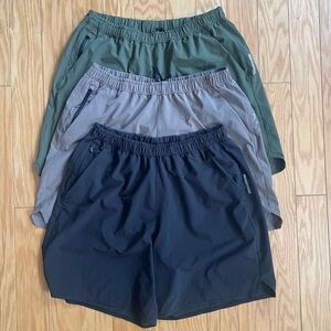 Set of Three REI Active Pursuit Athletic Shorts (Black, Lavender, and Green)